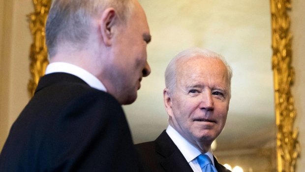 Joe Biden, right, speaks to Vladimir Putin prior to the U.S.-Russia summit at the Villa La Grange, in Geneva on June 16, 2021.