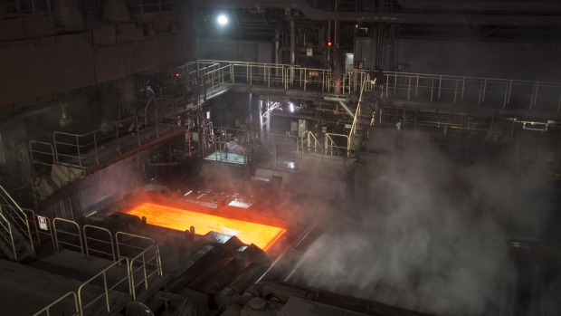 A hot steel slab moves along a conveyor of a plate mill at the Nippon Steel & Sumitomo Metal Corp. plant in Kashima, Ibaraki, Japan, on Wednesday, April 18, 2018. President Donald Trump and Japanese Prime Minister Shinzo Abe committed Wednesday to intensify bilateral trade talks. Trump is pushing for an agreement that would reduce the U.S. trade deficit with Japan, while Abe is seeking an exemption from the steel and aluminum tariffs that Trump announced last month. Photographer: Tomohiro Ohsumi/Bloomberg