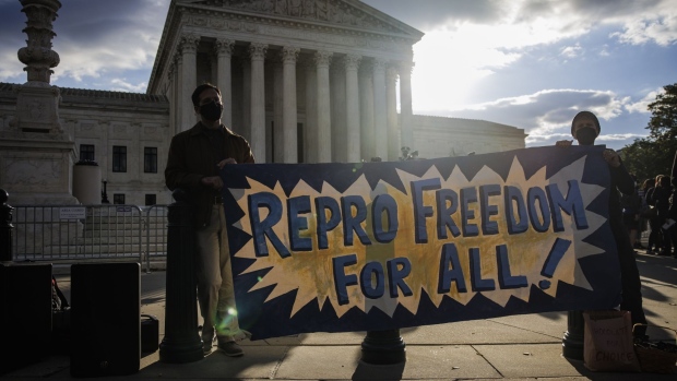 Pro-choice demonstrators hold a banner outside of the U.S. Supreme Court in Washington, D.C., U.S., on Monday, Nov. 1, 2021. The Texas abortion clash goes before the court today, with providers and the Biden administration trying to cut through a procedural haze to block a law that has largely shut down the practice in the country's second-largest state. Photographer: Samuel Corum/Bloomberg
