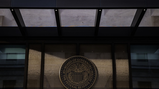 The seal of the Board of Governors of the U.S. Federal Reserve in Washington, D.C., U.S., on Saturday, Nov. 20, 2021. The Federal Reserve looks on course to consider a more rapid drawdown of its mammoth bond-buying program just weeks after it instituted a plan to scale the purchases back in a methodical manner. Photographer: Samuel Corum/Bloomberg