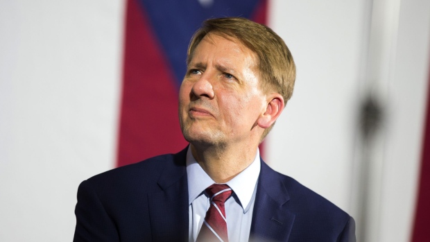 Richard Cordray, Democratic nominee for governor of Ohio, listens as former U.S. President Barack Obama, not pictured, speaks during a campaign rally in Cleveland, Ohio, U.S., on Thursday, Sept. 13, 2018. Cordray is a former U.S. President Barack Obama appointee who was director of the Consumer Financial Protection Bureau, the federal watchdog agency now being overhauled by Trump's administration.