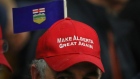 An attendee wears a "Make Alberta Great Again" hat while Peter Downing, co-founder of Wexit, not pictured, speaks during a rally at Notre Dame High School in Calgary, Alberta, Canada, on Saturday, Nov. 16, 2019. Canada is experiencing its own separatist movement, pitting the oil-rich west against the administrative centers of the east.