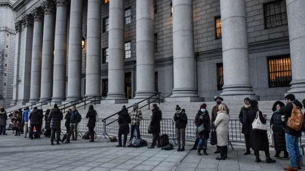 Members of the media line up outside of federal court for the Ghislane Maxwell trial in New York, U.S., on Monday, Nov. 29, 2021. Maxwell is charged with conspiring with her former boyfriend Jeffrey Epstein to sexually abuse minors.