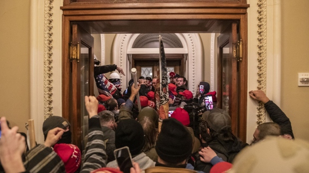 Trump supporters walk through the U.S. Capitol after breaching barricades to the building in Washington, D.C. on Jan. 6.