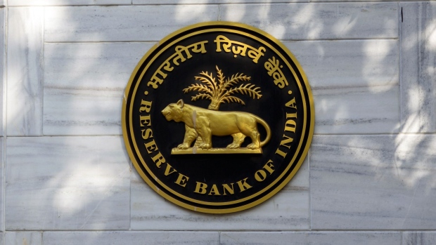 The Reserve Bank of India (RBI) logo is displayed outside the central bank in Mumbai, India, on Tuesday, March 3, 2020. RBI Governor Shaktikanta Das said he's ready to act to shield the economy from the coronavirus and reiterated there's room to cut interest rates if needed. Photographer: Kanishka Sonthali/Bloomberg