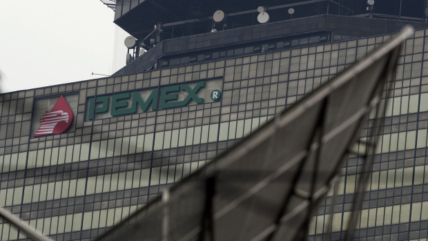 Signage for state-run oil company Petroleos Mexicanos, known as Pemex, is displayed on the company's headquarters building in Mexico City.