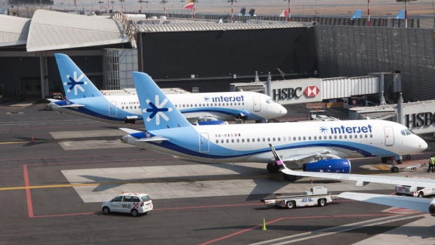 ABC Aerolineas SA de CV (Interjet) airplanes sit on the tarmac at Benito Juarez International Airport (MEX) in Mexico City, Mexico, on Friday, Jan. 5, 2018. Interjet made a splash as Mexico's first airline for the budget-conscious flyer when it was founded in 2005. But in the years that followed, the carrier hit turbulent skies, causing the company's overall market share to stagnate while Competitor Volaris captured more passengers. Photographer: Lujan Agusti/Bloomberg