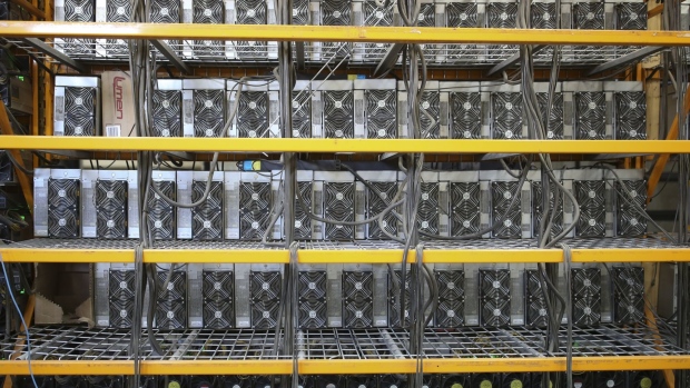 Cryptocurrency mining machines at a Canada Computational Unlimited Inc. computation center in Joliette, Quebec, Canada, on Friday, Sept. 10, 2021. CCU.ai, a Bitcoin mining center powered by hydroelectricity, has been conditionally approved for trading on the TSX Venture Exchange in Toronto under the stock symbol SATO. Photographer: Christinne Muschi/Bloomberg