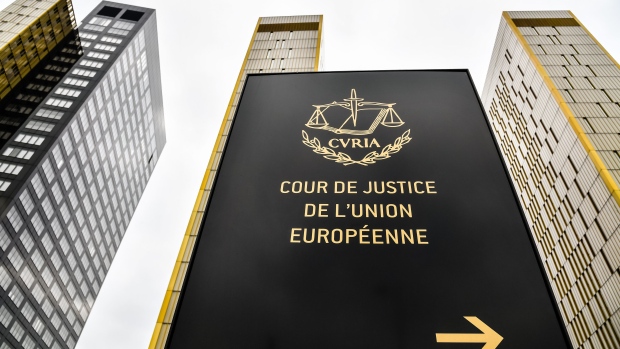 A sign stands outside the European Union (EU) Court of Justice buildings in the Plateau de Kirchberg district of Luxembourg, on Monday, July 15, 2019. Brexit has made Luxembourg a favorite EU hub for insurers, funds and asset managers to relocate to from the U.K. Moves include those by insurance giant American International Group Inc., private-equity firm Blackstone, RSA Insurance Group Plc, U.S. insurer FM Global, Lloyd's of London insurer Hiscox Plc and asset manager M&G Investments. Photographer: Geert Vanden Wijngaert/Bloomberg