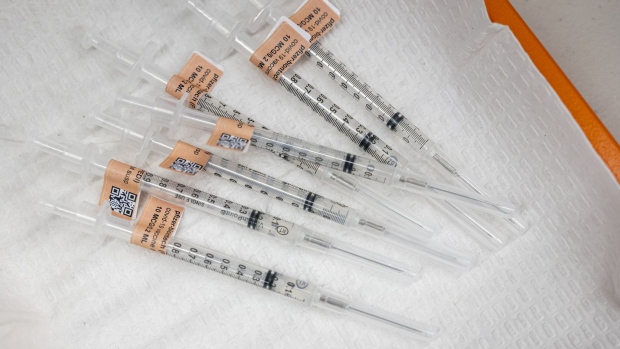 Prepared syringes with a pediatric dose of the Pfizer-BioNTech Covid-19 vaccine at a vaccination clinic at an elementary school in San Jose, California, U.S., on Thursday, Nov. 4, 2021. Younger children, ages 5 to 11-year-old, across the U.S. are now eligible to receive Pfizer Inc.'s Covid-19 vaccine, after the head of the Centers for Disease Control and Prevention granted the final clearance needed for shots to begin. Photographer: David Paul Morris/Bloomberg
