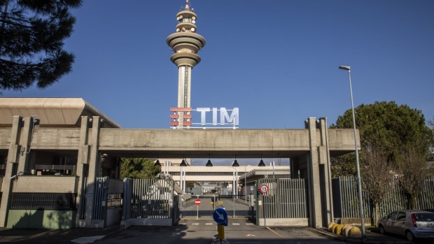 An entrance to the headquarters of Telecom Italia SpA in Rozzano, Italy, on Tuesday, Nov. 23, 2021. KKR & Co. is setting the stage for a battle of control at Telecom Italia with a 10.8 billion-euro ($12.2 billion) bid pitting the U.S. private-equity fund against France’s Vivendi SE.