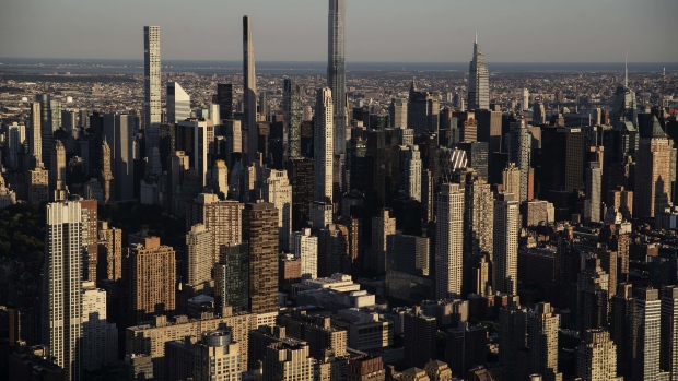 Buildings in the Manhattan skyline in New York, U.S., on Thursday June 17, 2021. New York state's pandemic mandates were lifted last week, after 70% of the adult population has now been given at least one dose of a coronavirus vaccine.