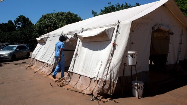 A nurse enters a vaccination tent at Parirenyatwa group of hospitals on December 01, 2021 in Harare, Zimbabwe. Z