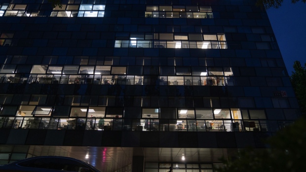 Illuminated office windows at the Didi Global Inc. headquarters at night in Beijing, China, on Monday, July 5, 2021. China expanded its latest crackdown on the technology industry beyond Didi to include two other companies that recently listed in New York, dealing a blow to global investors while tightening the government’s grip on sensitive online data.