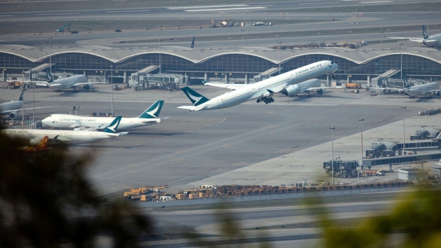 An aircraft operated by Cathay Pacific Airways Ltd. takes off from the Hong Kong International Airport in Hong Kong, China, on Tuesday, March 9, 2021. Cathay is scheduled to release annual results on March 10. Photographer: Kyle Lam/Bloomberg