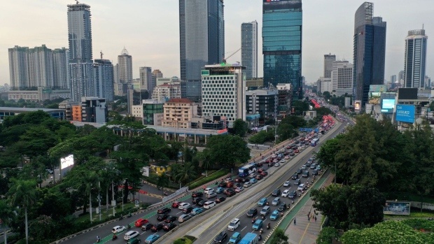 Traffic in the central business district of Jakarta, Indonesia, on Friday, Nov. 5, 2021. Indonesia's economy decelerated in the third quarter as harsh lockdowns to contain a record spike in Covid-19 cases outweighed higher commodity prices and trade. Photographer: Dimas Ardian/Bloomberg