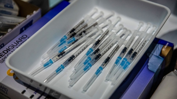 Syringes containing a dose of the Pfizer Inc. and BioNTech SE Covid-19 vaccine ready for administration at a vaccination center inside FC Barcelona’s Camp Nou stadium in Barcelona.
