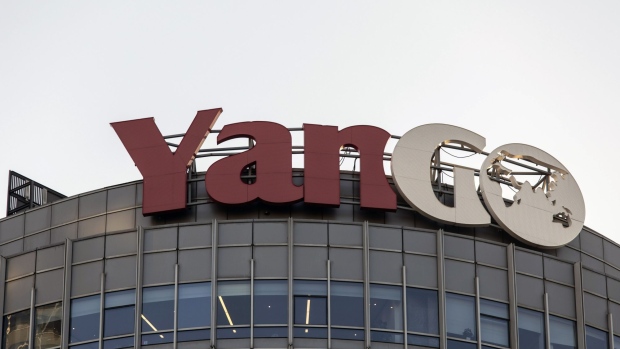 Signage for Yango Group Co. atop the company's headquarters in Shanghai, China, on Thursday, Nov. 25, 2021. The debt crisis engulfing the Chinese real estate sector is threatening to upend developers that have borrowed billions in green debt to fund sustainable buildings. Yango Group is struggling to meet their debt obligations and now faces "inevitable" default scenarios, according to S&P Global Ratings. Photographer: Qilai Shen/Bloomberg