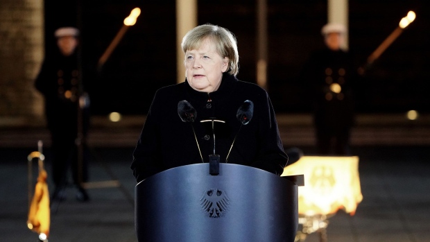 BERLIN, GERMANY - DECEMBER 02: Outgoing German Chancellor Angela Merkel delivers a speech as she attends her military tattoo ceremony hosted by the Bundeswehr on December 02, 2021 in Berlin, Germany. Merkel will be stepping down soon to make way for German Social Democrat (SPD) Olaf Scholz, who will lead a coalition government of SPD, Greens and German Free Democrats (FDP).(Photo by Friedemann Vogel - Pool/Getty Images) Photographer: Pool/Getty Images Europe