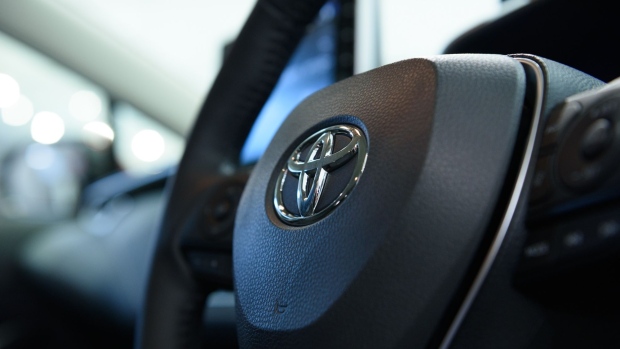 The Toyota Motor Corp. badge sits on a steering wheel of the company's Corolla Touring vehicle during an unveiling event in Tokyo, Japan, on Tuesday, Sept. 17, 2019. Toyota launched a redesigned Corolla sedan and Corolla Touring wagon in Japan on Tuesday.