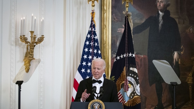 U.S. President Joe Biden speaks during the the Kennedy Center Honorees Reception in the East Room of the White House in Washington, D.C., U.S., on Sunday, Dec. 5, 2021. The John F. Kennedy Center for the Performing Arts 44th Honorees for lifetime artistic achievements include operatic bass-baritone Justino Diaz, Motown founder Berry Gordy, Saturday Night Live creator Lorne Michaels, actress Bette Midler, and singer-songwriter Joni Mitchell. Photographer: Al Drago/Bloomberg