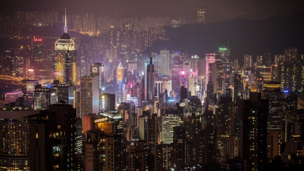 Buildings are seen from Victoria Peak at night in Hong Kong, China, on Wednesday, Aug. 28, 2019. Hong Kong's hotel industry is struggling with a collapse in bookings after thousands of protesters shut down flights from the territory's airport in an escalation of months of clashes with police. Photographer: Paul Yeung/Bloomberg