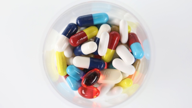 Brightly coloured pharmaceutical medication, including antibiotics, paracetamol, Ibuprofen and cold relief tablets, manufactured by a variety of companies sit in this arranged photograph in London, U.K., on Friday, April 27, 2018. Pharmaceutical companies may see approval times cut to 14 months vs. 19 and about $370 million of sales brought forward per antibiotic after global regulators aligned rules to combat bacterial resistance. Photographer: Chris Ratcliffe/Bloomberg