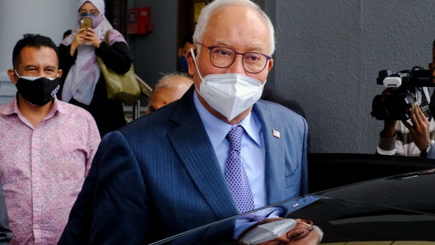 Najib Razak, Malaysia's former prime minister, wears a protective mask as he departs the Kuala Lumpur Courts Complex in Kuala Lumpur, Malaysia, on Monday, Aug. 23, 2021. Ismail Sabri Yaakobwas sworn in as Malaysia's third prime minister in 18 months, heralding the return of the United Malays National Organisation (UMNO) that ruled Malaysia since independence from Britain in 1957 before it was ousted in 2018 in part due to the multibillion-dollar corruption scandal involving state fund 1MDB.