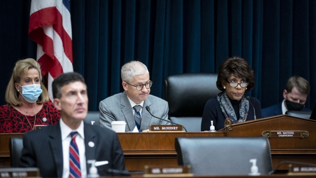 Representative Patrick McHenry, a Republican of North Carolina and ranking member of the House Financial Services Committee, speaks as chairwoman Representative Maxine Waters, a Democrat from California, right, listens during a hearing in Washington, D.C., U.S., on Wednesday, Dec. 1, 2021. Stocks slid, short-term interest rates rose and measures of equity volatility surged Tuesday after the central bank chairman warned Congress that elevated inflation could justify ending asset purchases sooner than planned. Photographer: Al Drago/Bloomberg