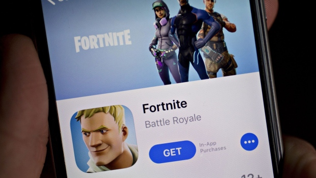 The Epic Games Inc. Fortnite: Battle Royale video game is seen in the App Store on an Apple Inc. iPhone displayed for a photograph in Washington, D.C., U.S., on Thursday, May 10, 2018. Fortnite, the hit game that's denting the stock prices of video-game makers after signing up 45 million players, didn't really take off until it became free and a free-for-all. Photographer: Andrew Harrer/Bloomberg