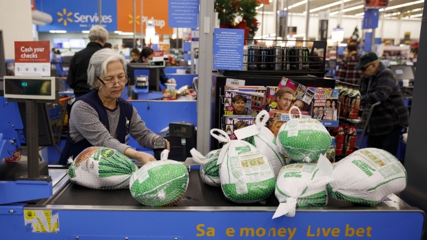 A cashier scans Jennie-O turkeys at a Walmart Inc. store in Burbank, California, U.S., on Tuesday, Nov. 26, 2019. A PWC survey shows that 36% of consumers surveyed plan to shop on Black Friday. Deals will ultimately dictate where spending and visits go. Photographer: Patrick T. Fallon/Bloomberg