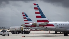 Tails fins of passenger aircraft operated by American Airlines Group Inc. at Miami International Airport in Miami, Florida, U.S., on Wednesday, June 16, 2021. Daily U.S. air travelers exceeded 2 million for the first time since the coronavirus pandemic began, reaching almost three-quarters of the volume recorded on the same day in 2019, according to the Transportation Security Administration.