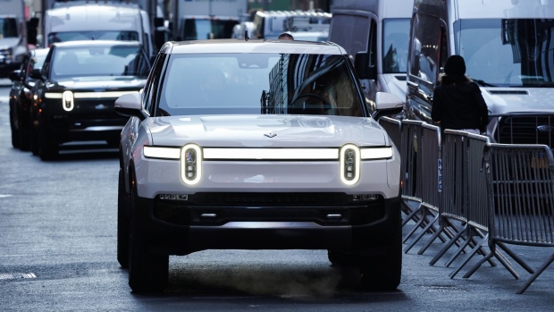 A Rivian R1T electric pickup truck during the company's IPO outside the Nasdaq MarketSite in New York, U.S., on Wednesday, Nov. 10, 2021. Electric vehicle-maker Rivian Automotive Inc. priced shares in its initial public offering at $78 apiece to raise about $11.9 billion, the biggest first-time share sale this year.