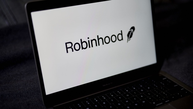 The Robinhood logo on a laptop computer arranged in the Brooklyn borough of New York, U.S., on Saturday, Dec. 19, 2020. Robinhood Markets will pay $65 million to settle allegations that it failed to properly inform clients it sold their stock orders to high-frequency traders and other firms, putting a major compliance headache behind the brokerage even as new ones emerge. Photographer: Gabby Jones/Bloomberg