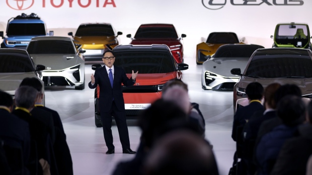 Akio Toyoda, president of Toyota Motor Corp., speaks during a news conference at the company's showroom in Tokyo, Japan, on Tuesday, Dec. 14, 2021. The world’s biggest carmaker is planning to invest 4 trillion yen ($35.2 billion) to supercharge its EV push, with a target to sell 3.5 million units annually by the end of the decade, according to Toyoda. Toyota will roll out 30 electric models by 2030, a step up from a prior plan to introduce 15 EVs globally by 2025. Photographer: Kiyoshi Ota/Bloomberg