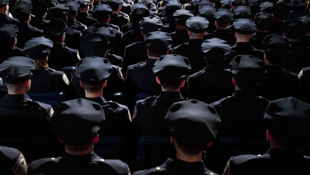 The newest members of the New York City Police Department (NYPD) attend their police academy graduation ceremony at the Theater at Madison Square Garden, March 30, 2017 in New York City. Photographer: Drew Angerer/Getty Images