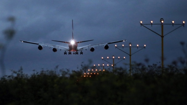 An Airbus SE A380 aircraft operated by Qantas Airways Ltd. approaches to land at Sydney Airport in Sydney, Australia, on Thursday, Feb. 21, 2019. Qantas' international business is bearing the brunt of higher fuel costs, which are shredding the division's profit margin. Photographer: Brendon Thorne/Bloomberg