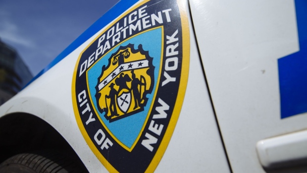 A New York City Police Department (NYPD) logo is displayed on the side of a vehicle in the Tribeca neighborhood of New York, U.S., on Wednesday, June 17, 2020. With two weeks to get City Council approval of a spending plan that plugs a $9 billion revenue gap in the next two years, Mayor Bill de Blasio faces renewed calls to slash more than $1 billion from the NYPD. Photographer: Angus Mordant/Bloomberg