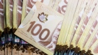 Canadian one hundred dollar banknotes are arranged for a photograph in Toronto, Ontario, Canada.