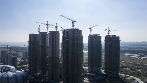 High-rise apartment buildings at China Evergrande Group's under-construction Riverside Palace development in Taicang, Jiangsu province, China, on Friday, Sept. 24, 2021. China's housing regulator has stepped up oversight of China Evergrande Group's bank accounts to ensure funds are used to complete housing projects and not diverted to pay creditors. Photographer: Qilai Shen/Bloomberg