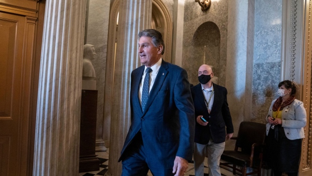 Senator Joe Manchin, a Democrat from West Virginia, walks through the U.S. Capitol in Washington, D.C., U.S., on Thursday, Dec. 16, 2021. Democrats are seeking a path forward on legislation to strengthen voting rights as negotiations stumble on their $2 trillion tax and spending reconciliation measure.