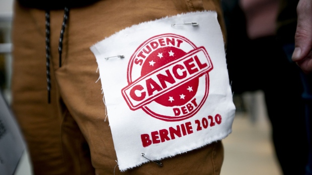 An attendee wears a patch that reads "Cancel Student Debt" ahead of a Get Out The Vote rally with Senator Bernie Sanders, an Independent from Vermont and 2020 presidential candidate, in Detroit, Michigan, U.S., on Friday, March 6, 2020. Sanders said his competitor, Joe Biden, could beat President Donald Trump in November, but added that he would be the stronger general-election candidate. Photographer: Anthony Lanzilote/Bloomberg