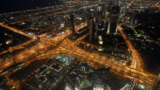 Sheik Zayed Road, one of the city's main thoroughfares, is lit by traffic light trails at night in Dubai, United Arab Emirates, on Sunday, Dec. 11, 2011. Dubai and its state-owned non-financial companies have $101.5 billion of outstanding debt and may need further financial support to meet those obligations, Moody's said. Photographer: Bloomberg/Bloomberg