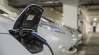 An electric charging plug charges a Nissan Motor Co. Leaf electric automobile