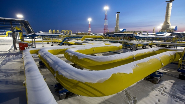 Snow covers sections of connected pipework in the yard as night falls at the Gazprom PJSC Atamanskaya compressor station, part of the Power Of Siberia gas pipeline, near Svobodny, in the Amur region, Russia, on Wednesday, Dec. 11, 2019. The pipeline, which runs from Russia’s enormous reserves in eastern Siberia and will eventually be 3,000 kilometers (1,900 miles) long, will help satisfy China’s vast and expanding energy needs. Photographer: Andrey Rudakov/Bloomberg