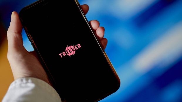 The logo for Triller is displayed on a smartphone Photographer: Gabby Jones/Bloomberg