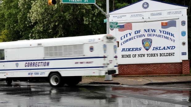 A New York City Corrections bus turns off of the Rikers Island entry road in New York, U.S., on Friday, May 20, 2011. Dominique Strauss-Kahn, former managing director of the International Monetary Fund (IMF) who is currently out on bail following charges of sexual assault and attempted rape of a hotel housekeeper, was discharged from jail after a New York judge ordered his release to temporary housing in downtown Manhattan, where he will be under 24-hour armed guard. Photograph: Rick Maiman/Bloomberg