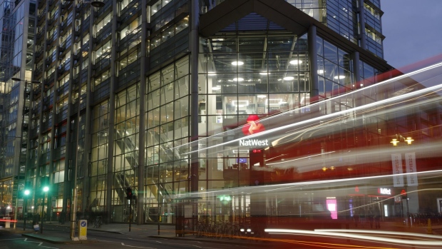 A bus passes NatWest Group Plc offices in London, U.K., on Friday, Oct. 22, 2021. The leaders of Europe's top banks agree they have a lot riding on the recent surge in consumer prices. Photographer: Luke MacGregor/Bloomberg