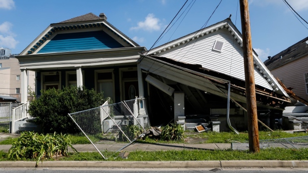 Debris from a collapsed house after Hurricane Ida in New Orleans, Louisiana, U.S., on Friday, Sept. 3, 2021. A second critical transmission line that delivers power to New Orleans is up and running again and flights are slowing resuming at the city's airport Thursday.