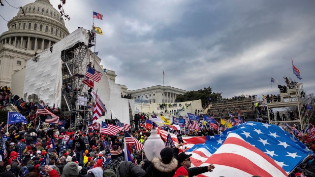 Trump supporters clash with police and security forces as people try to storm the US Capitol on January 6, 2021 in Washington, D.C.